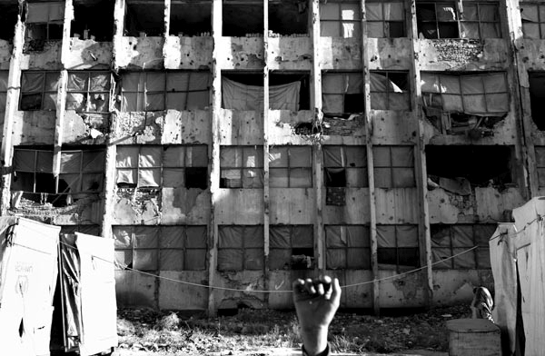 Department 5 internal displaced camp in the former Soviet Embassy Compound in the outskirts of Kabul, Afghanistan is home to 50 Afghan refuge families from Pakistan and Iran. The Afghan government has given the refugees eviction notice as they intend to renovate this building for governmental offices. October 2006.