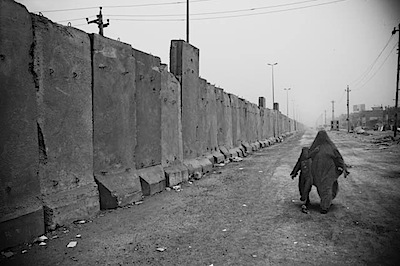 zoriah_iraq_war_baghdad_sadr_city_wall_barrier_woman_child